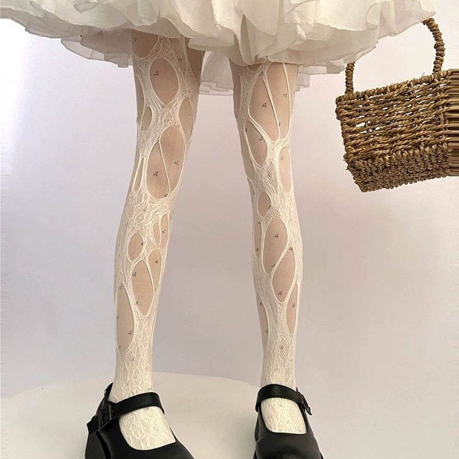 ③ Sexy Ripped Tights – Bold & Edgy Look